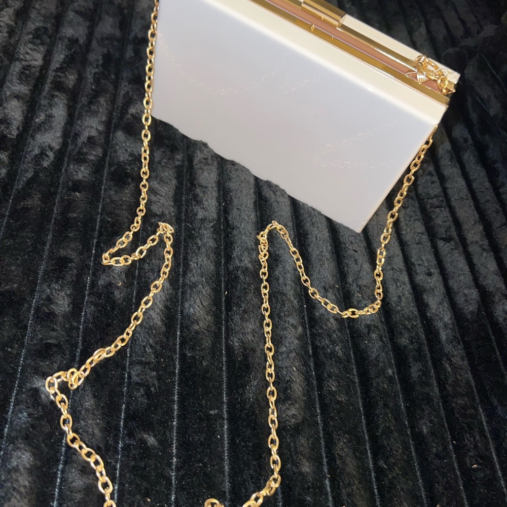 Elegant White Clutch with Gold Chain